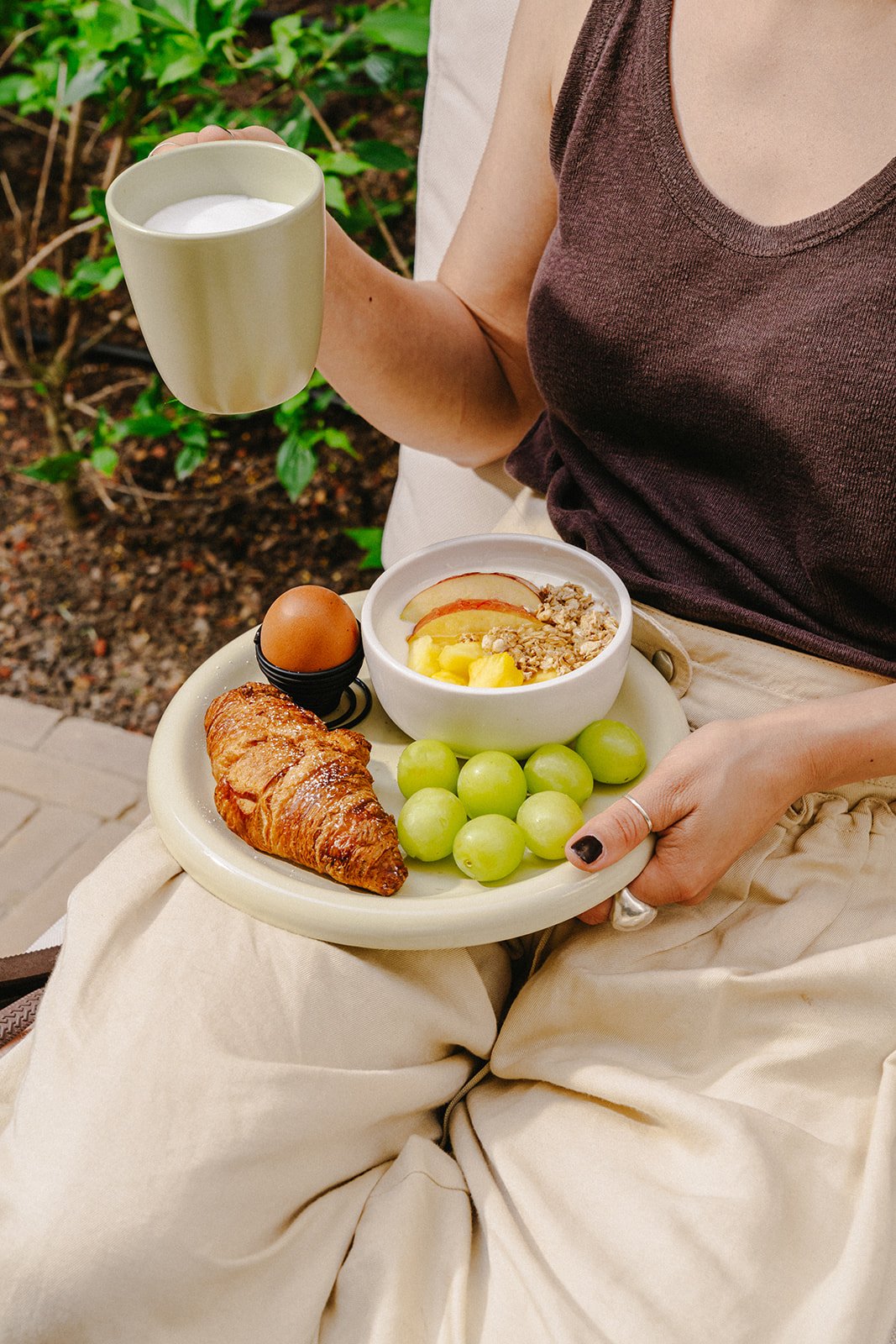 Breakfast tray with croissant, fruit and coffee at A-STAY