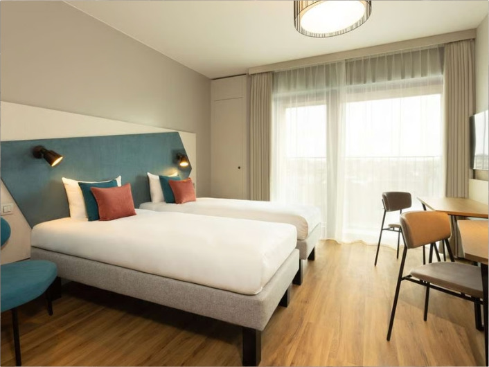 De Studio Twin van A-STAY Studios met twee eenpersoonsbedden